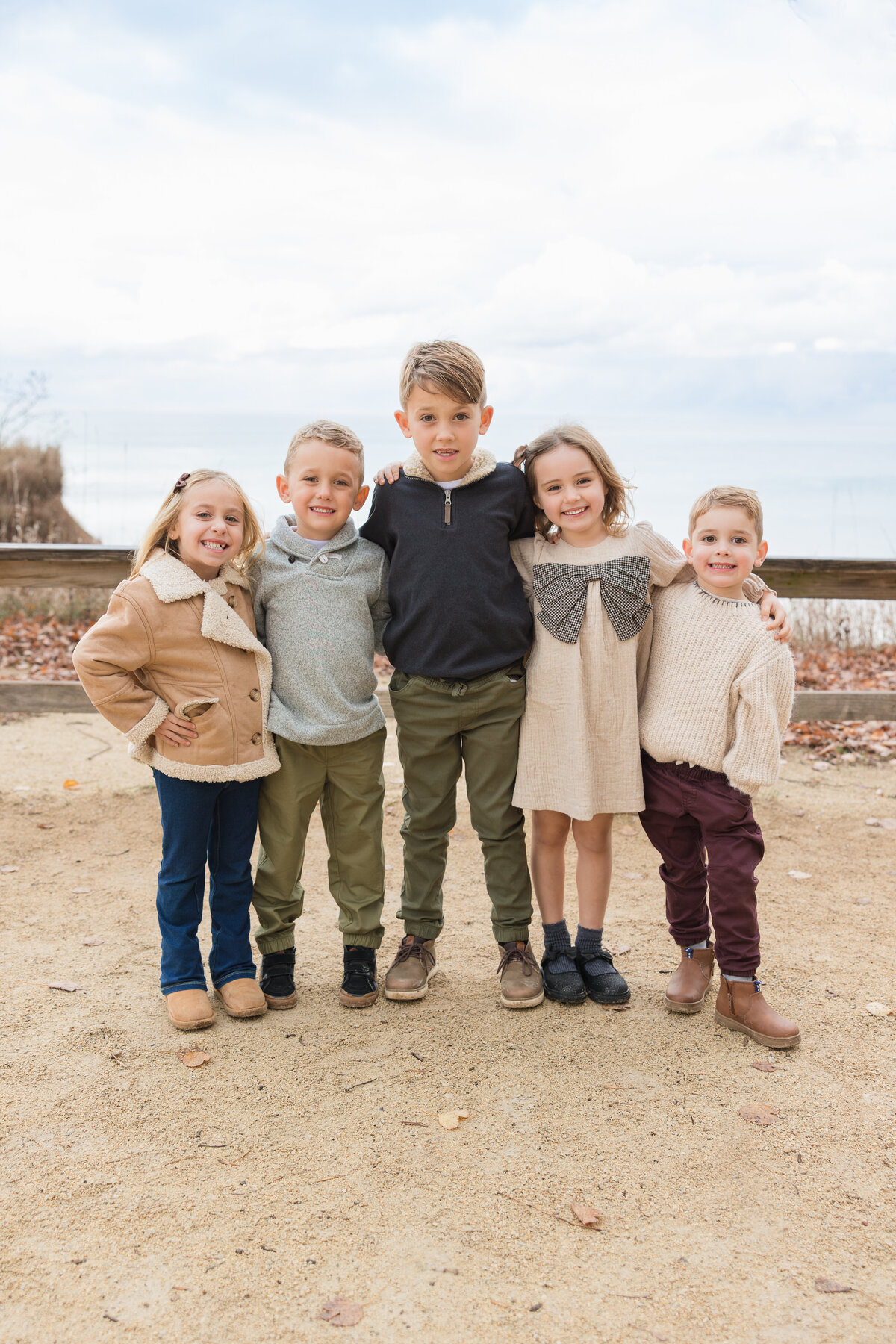 A group of kids standing together and smiling
