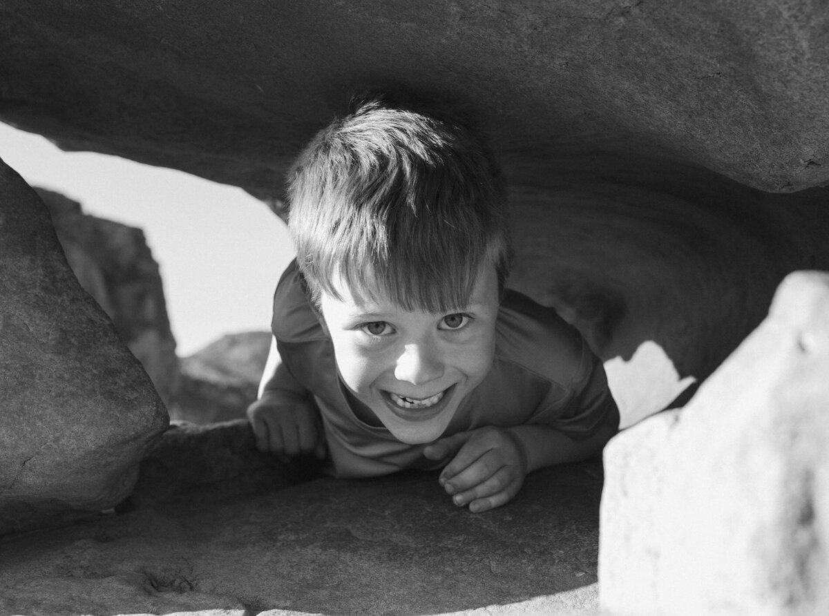 young child smiling as he plays and enjoys the outdoors at Smith Rock State Park