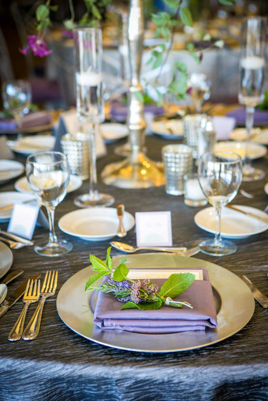 purple napkin on silver herb bunch with silver linen