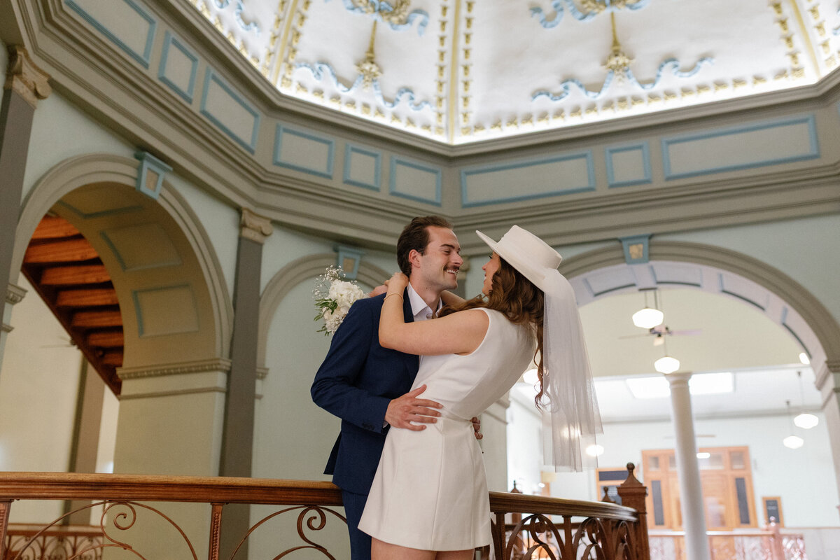 Fort Worth couple smiling together during courthouse elopement.