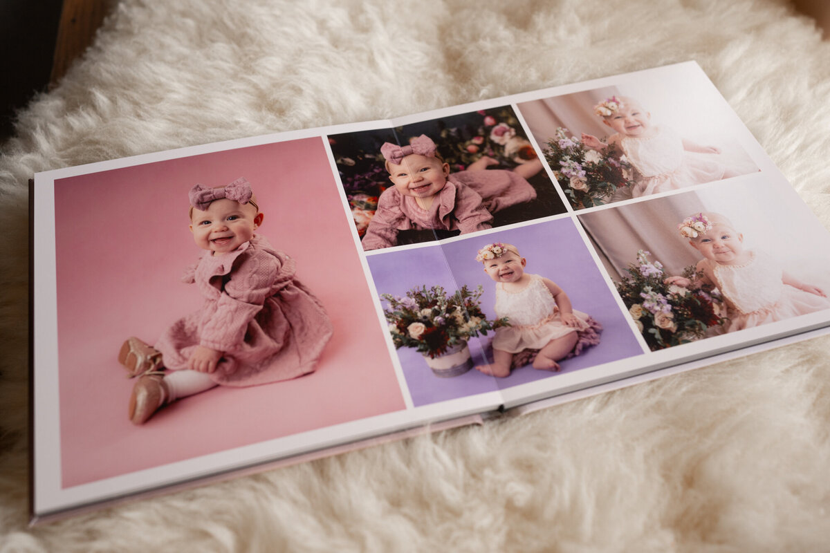 An open baby portrait heirloom album on a blanket