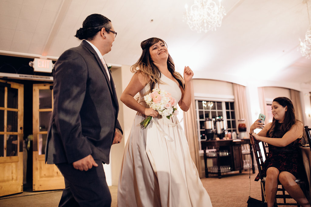 Wedding Photograph Of Groomsman And Bridesmaid With Her Eyes Closed Los Angeles