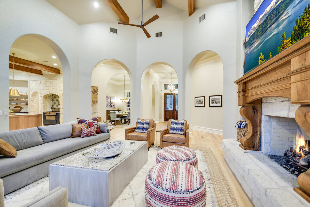 Large living room with seating area and fireplace