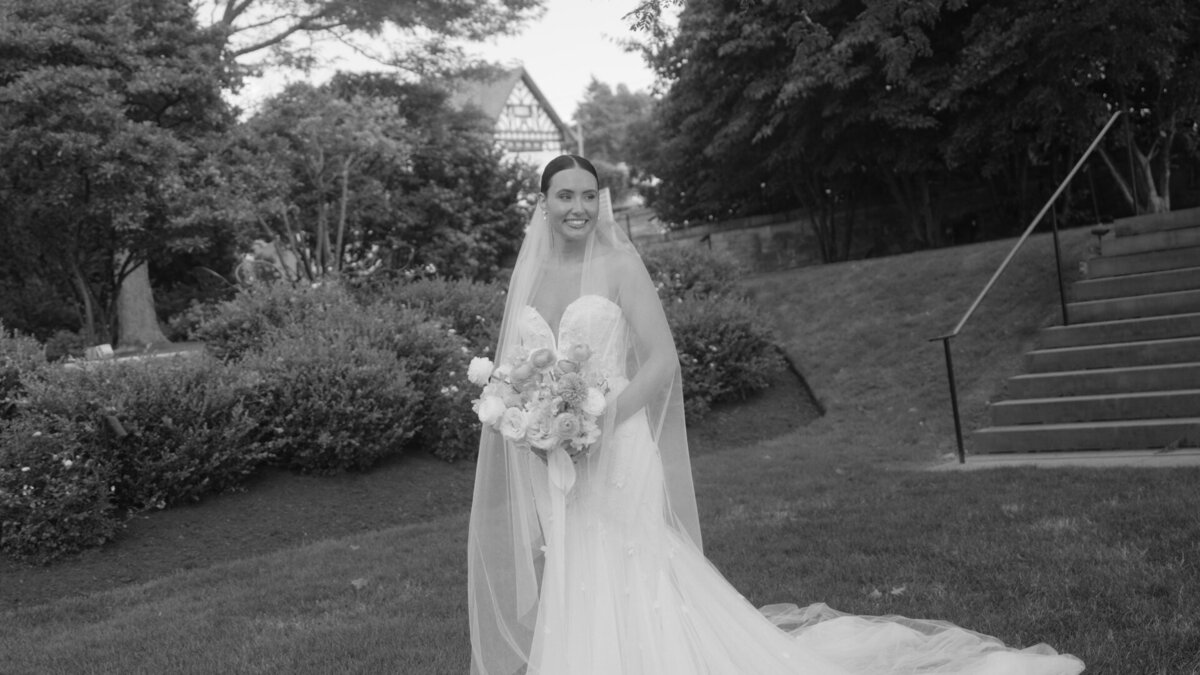 Bride smiling outside the wedding venue.