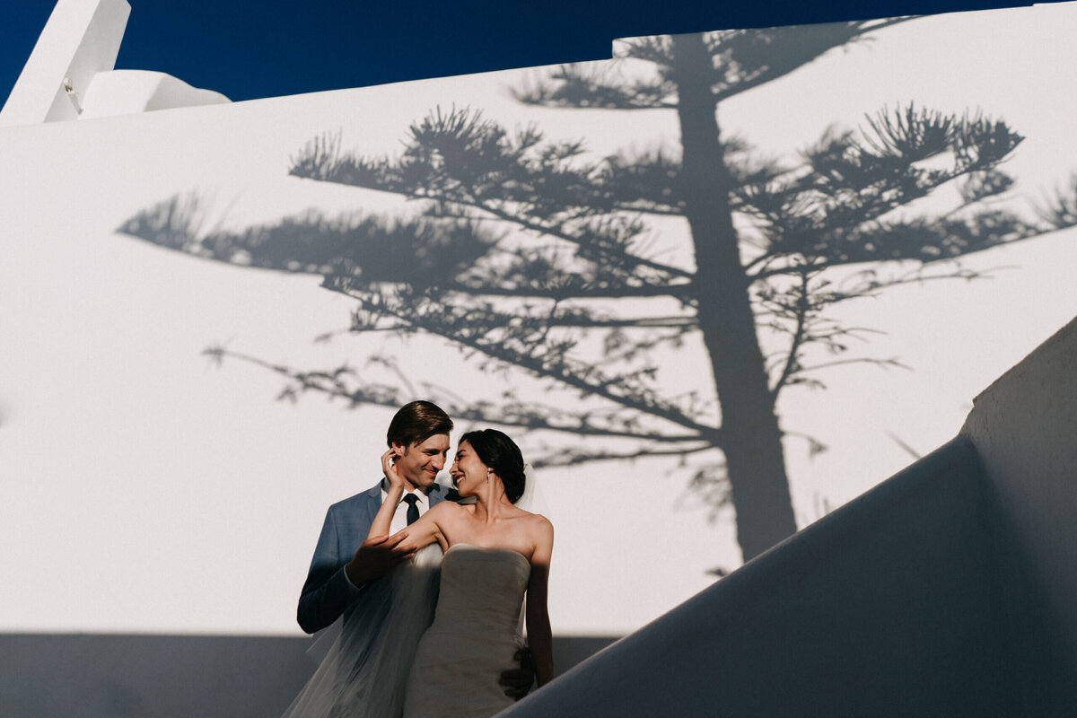 bride-and-groom-creative-portrait-in-santorini-scaled