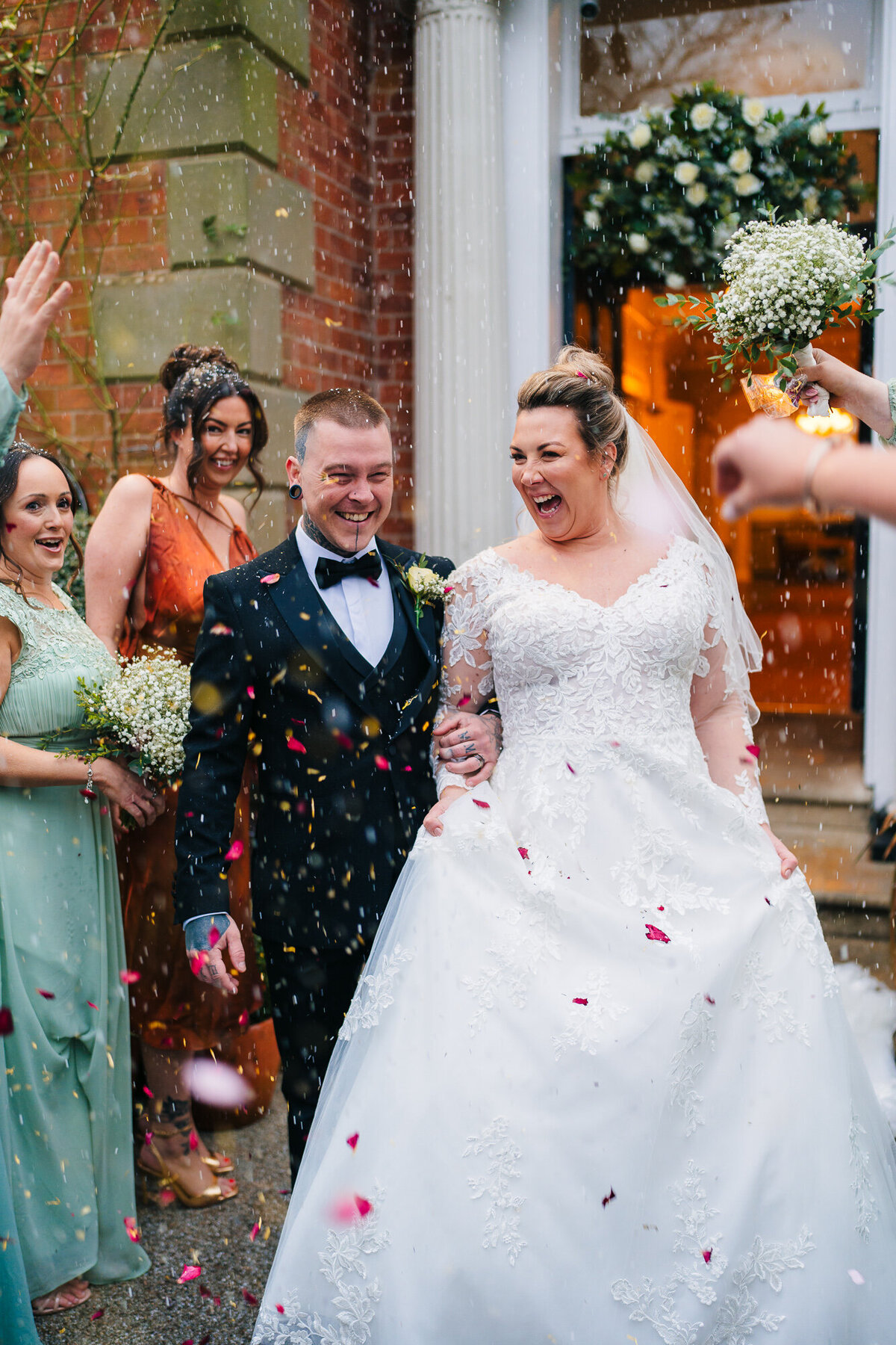 Confetti shot withthe bride and groom outside takne by documentary wedding photographer Anthony Horseman