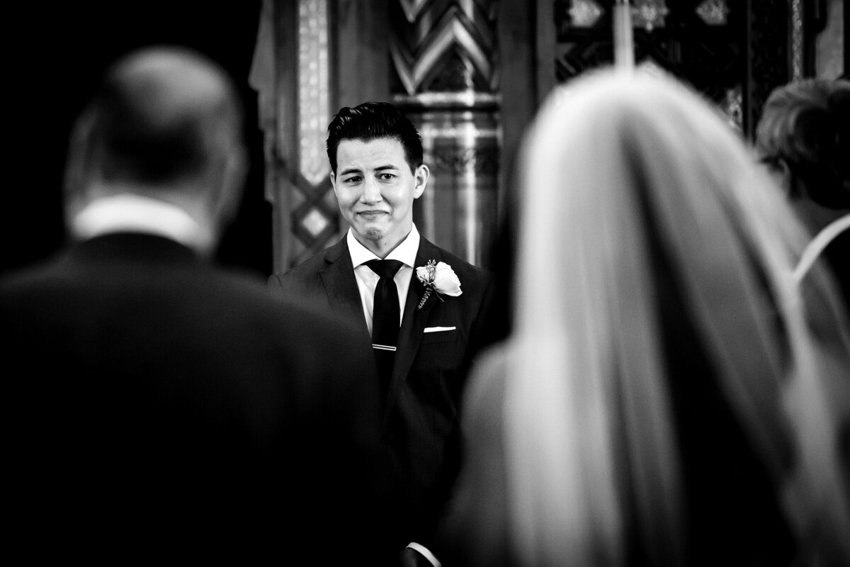 A groom reacts to seeing his bride during a Congress Hotel wedding.
