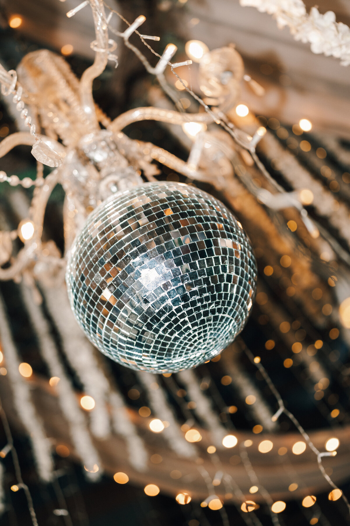 Close-up of a disco ball hanging at a Nashville, TN wedding reception—capturing the modern, party-ready vibe in a cinematic celebration setting.