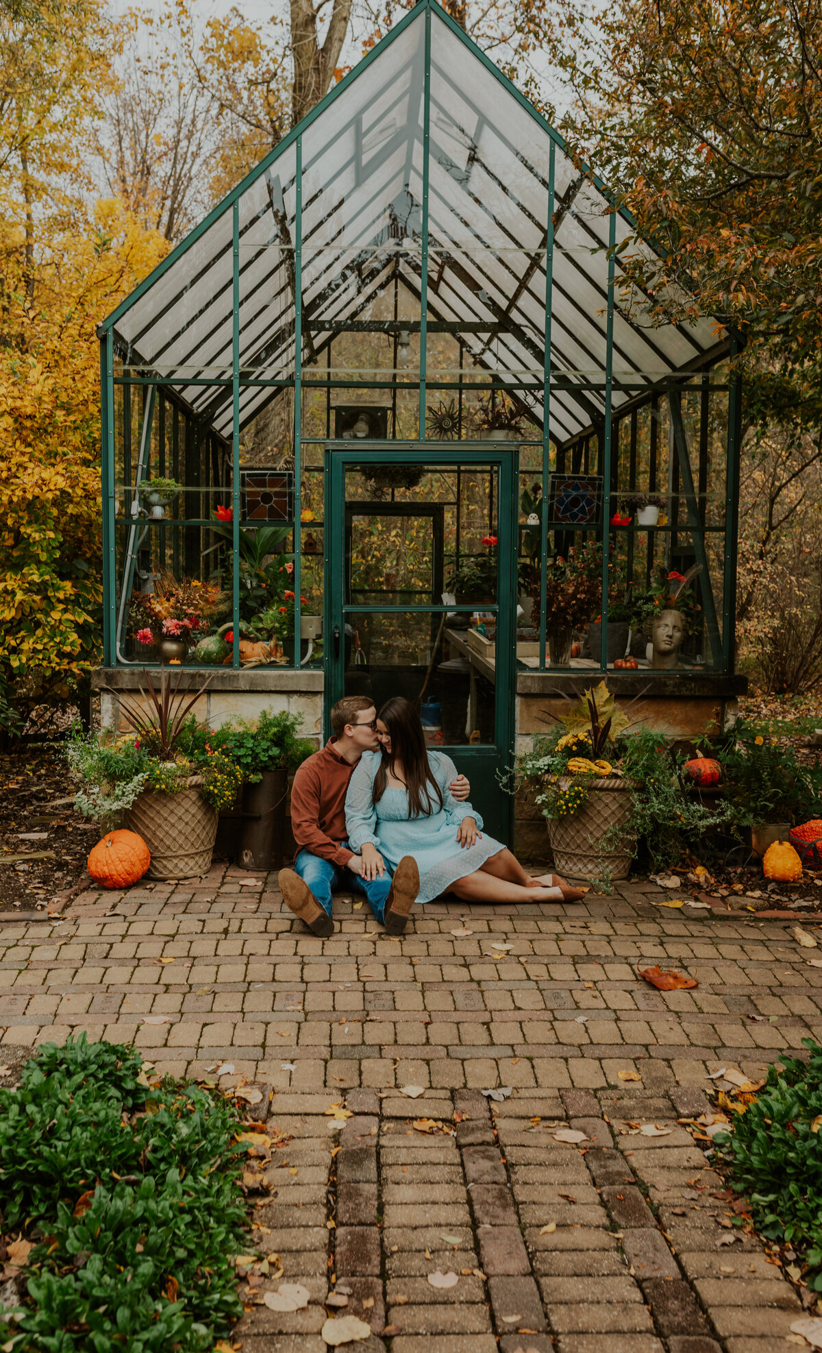 Couple in botanical garden, romantic Indiana engagement session.