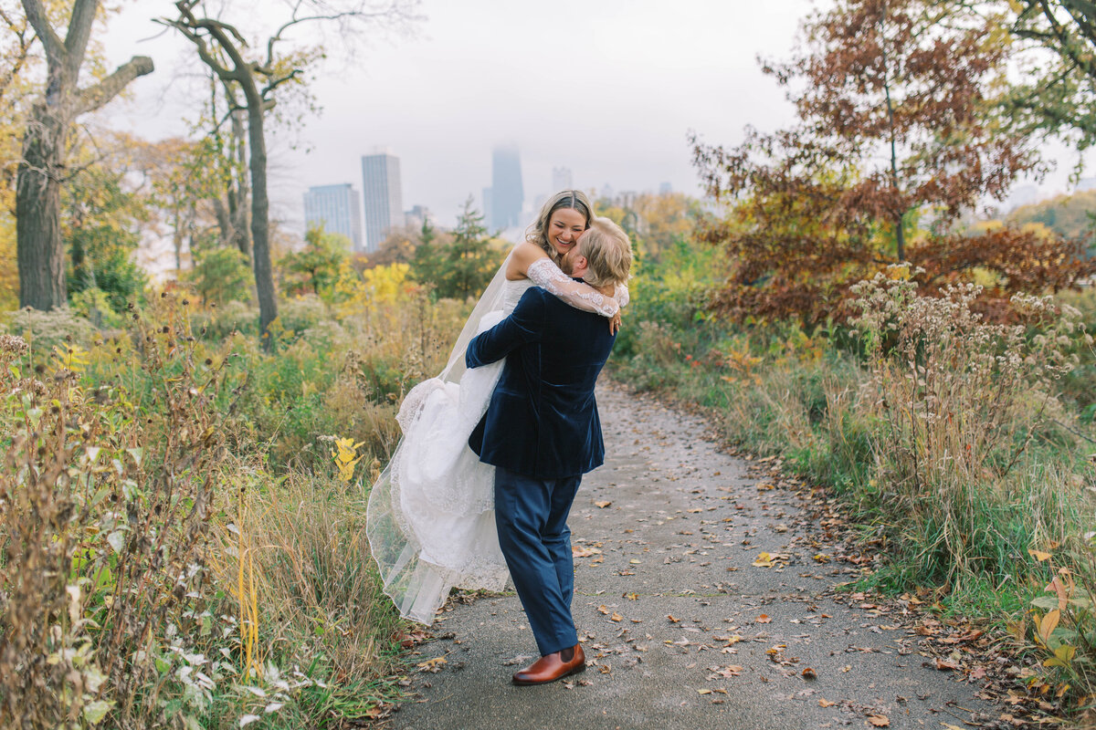 Bride and groom hugging on a trail in Chicago