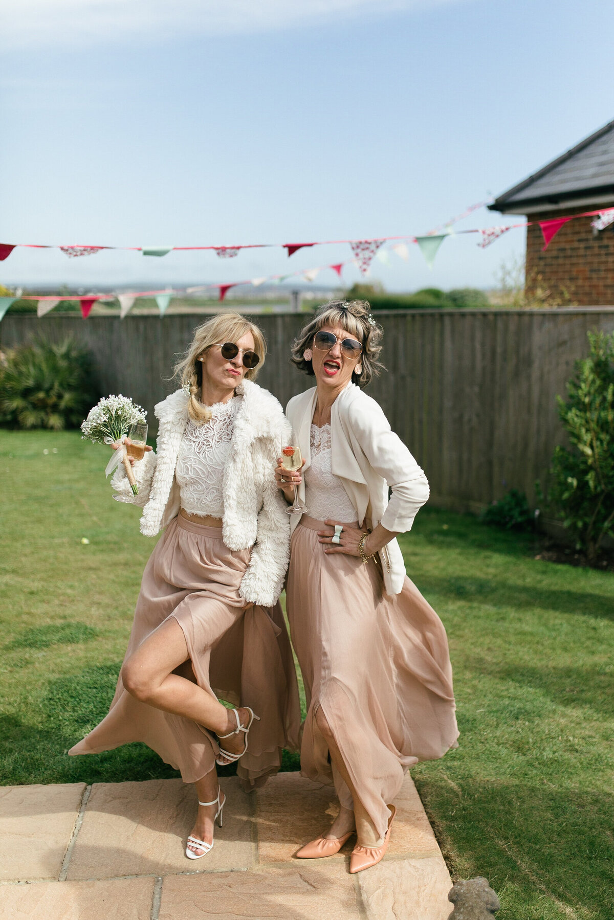 bridesmaids have candid photo during wedding reception