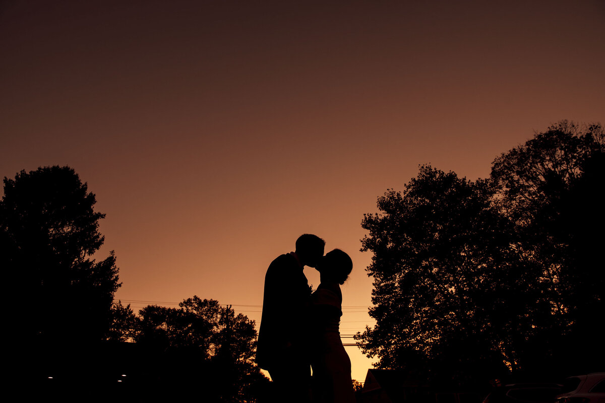 Mendenhall Inn | Bride and groom silhouette kissing during golden sunset summer wedding | Mendenhall, Pennsylvania