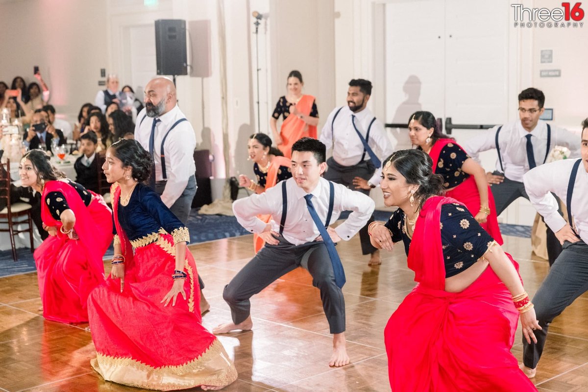 Indian wedding reception with a traditional synchronized dance