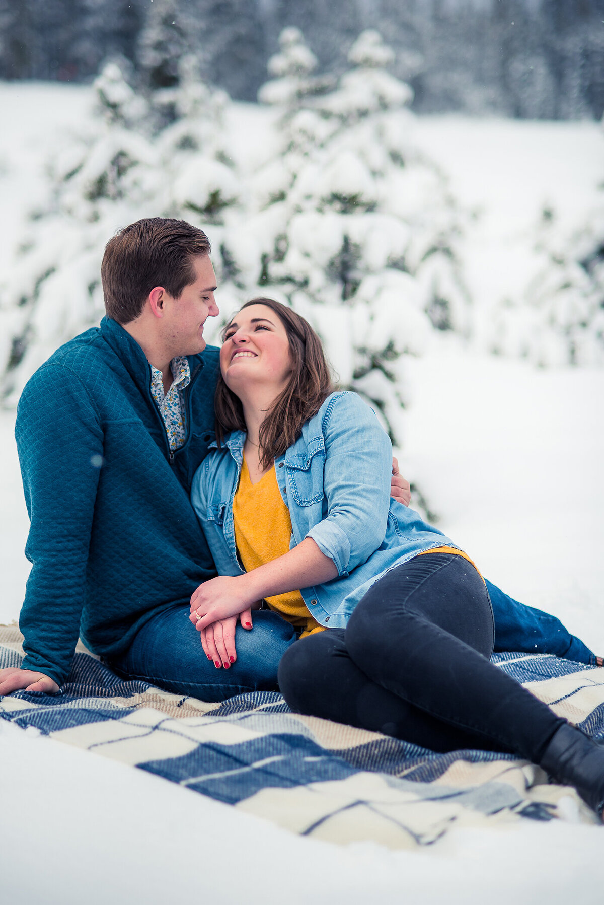 couple sitting in snow