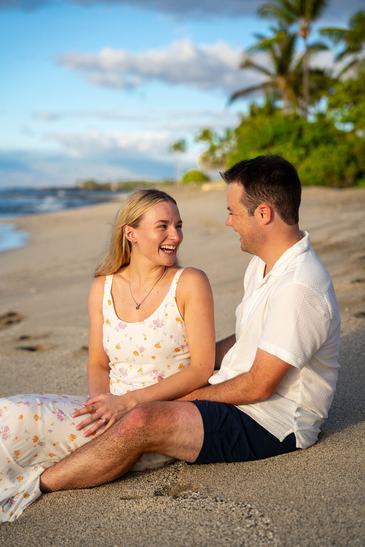 Hawaii engagement photography of couple sitting on the beach