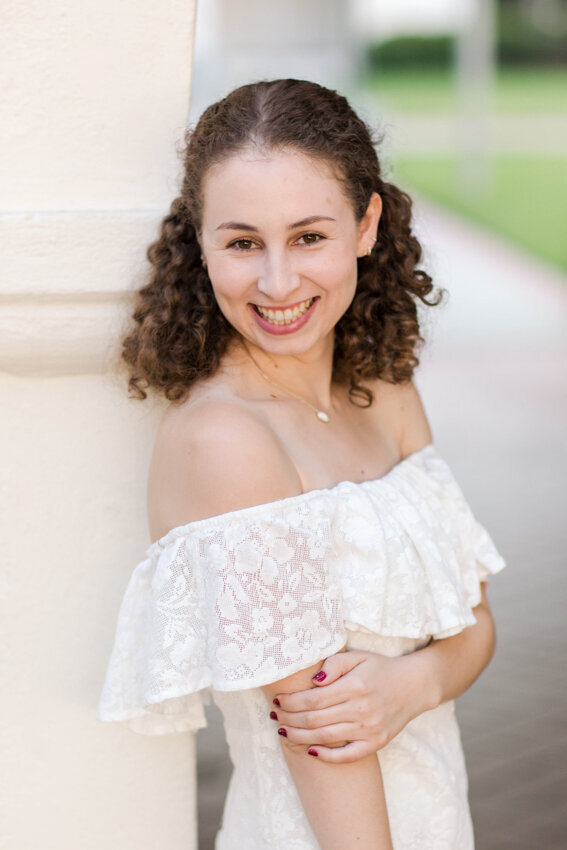 San Diego State senior leaning against wall