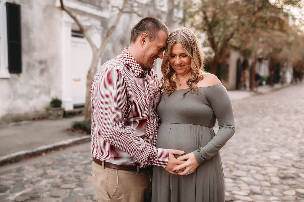 Expectant parents pose for Maternity Photoshoot in Charleston.