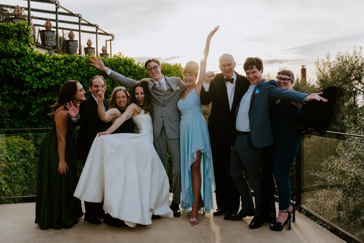 Couple celebrating their elopement with their family