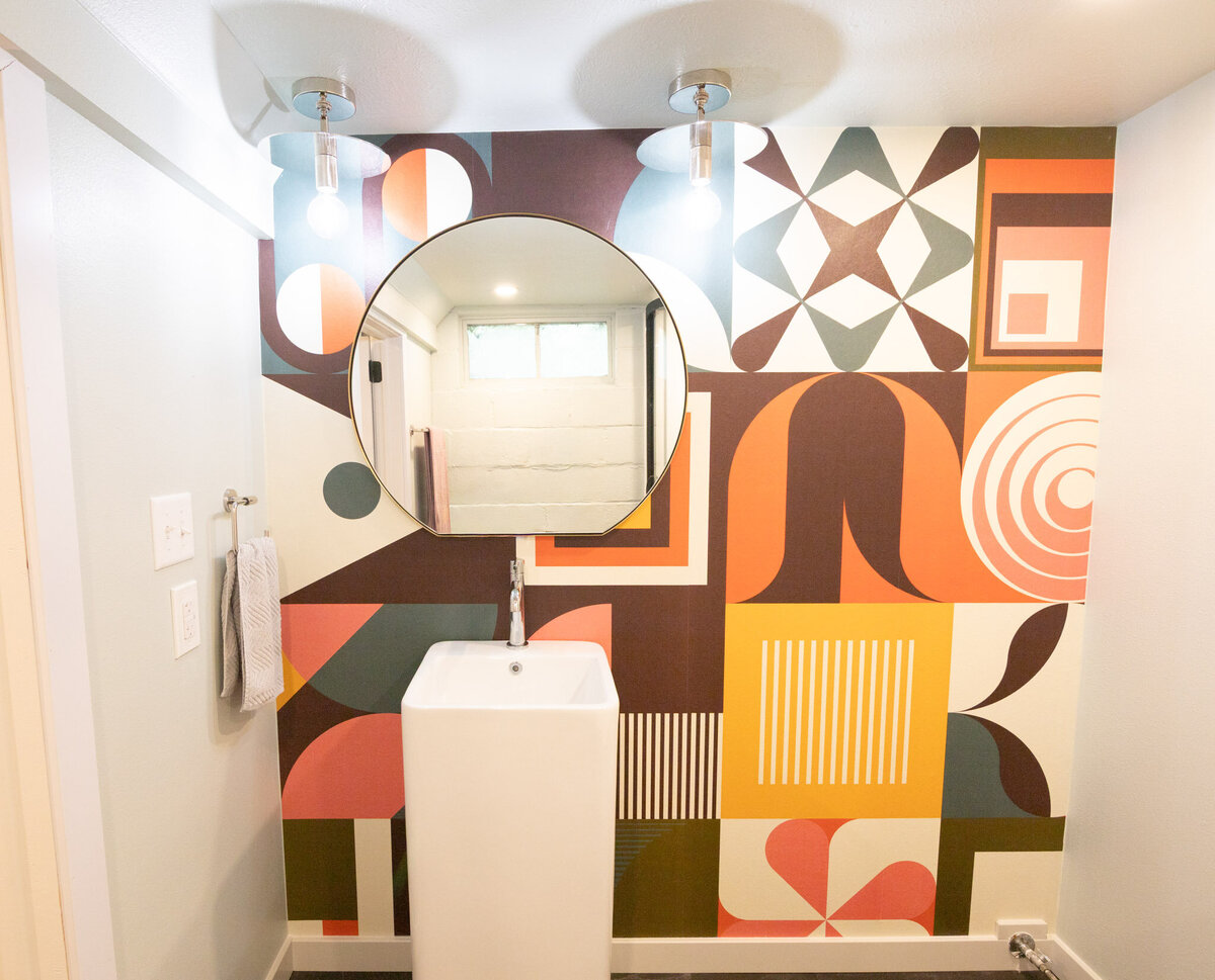 basement bathroom remodel with colorful wallpaper