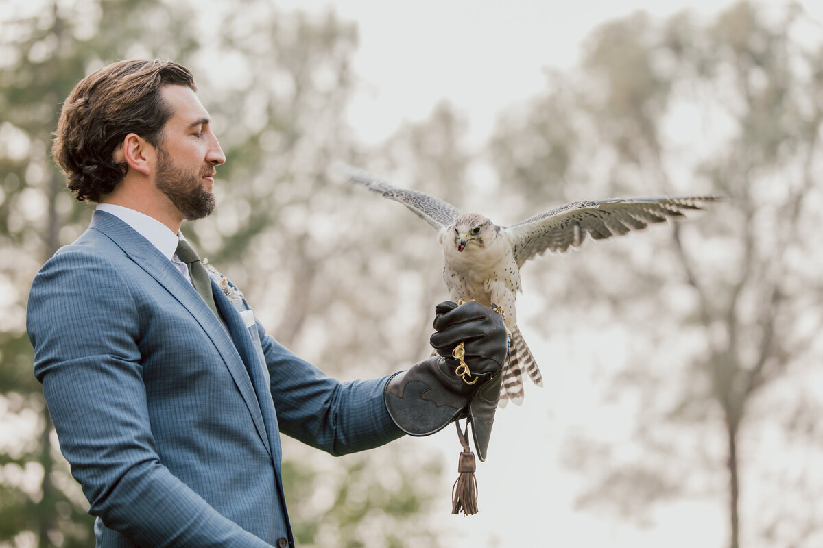 man holding falcon