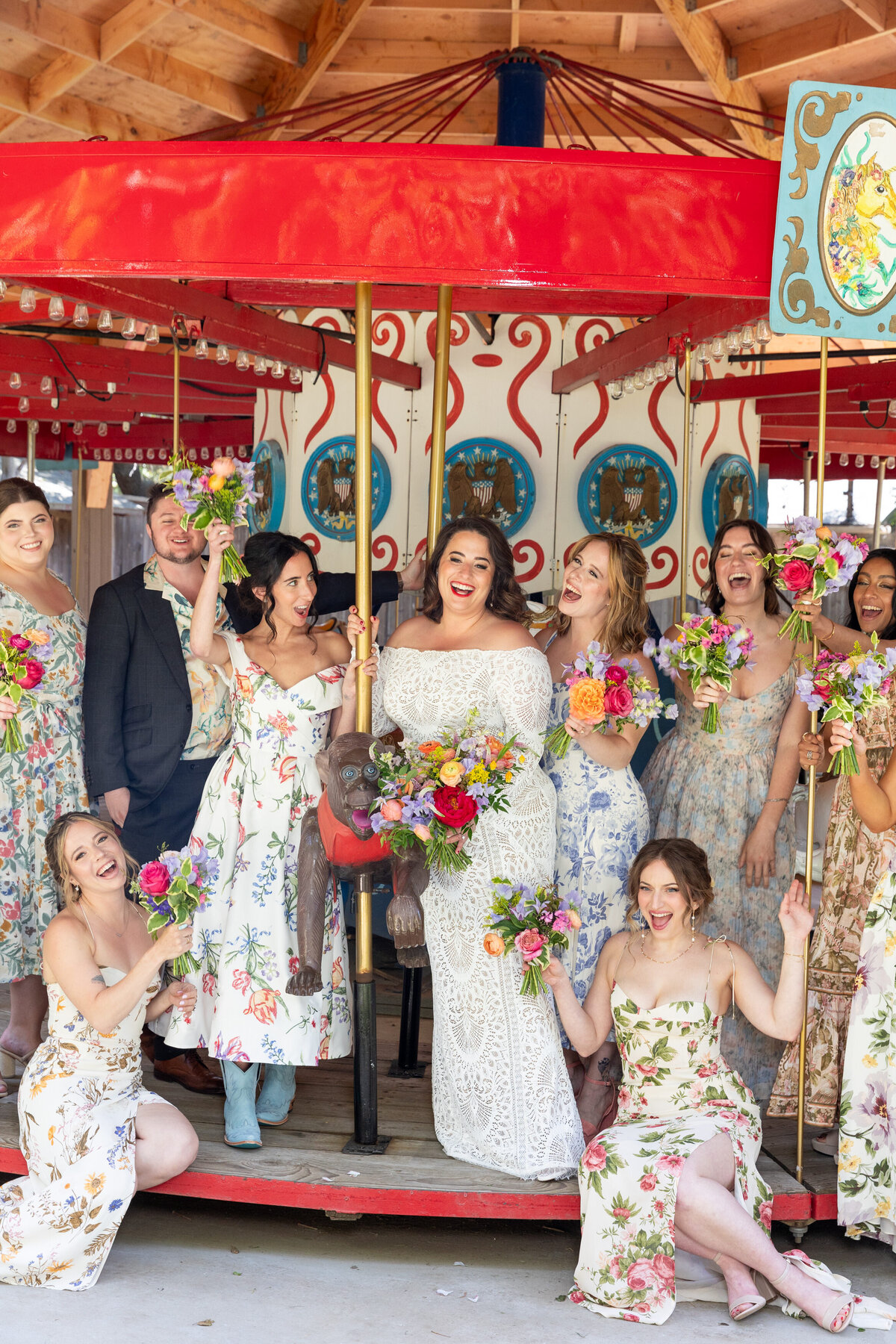 A bride and her wedding party standing on a merry go round