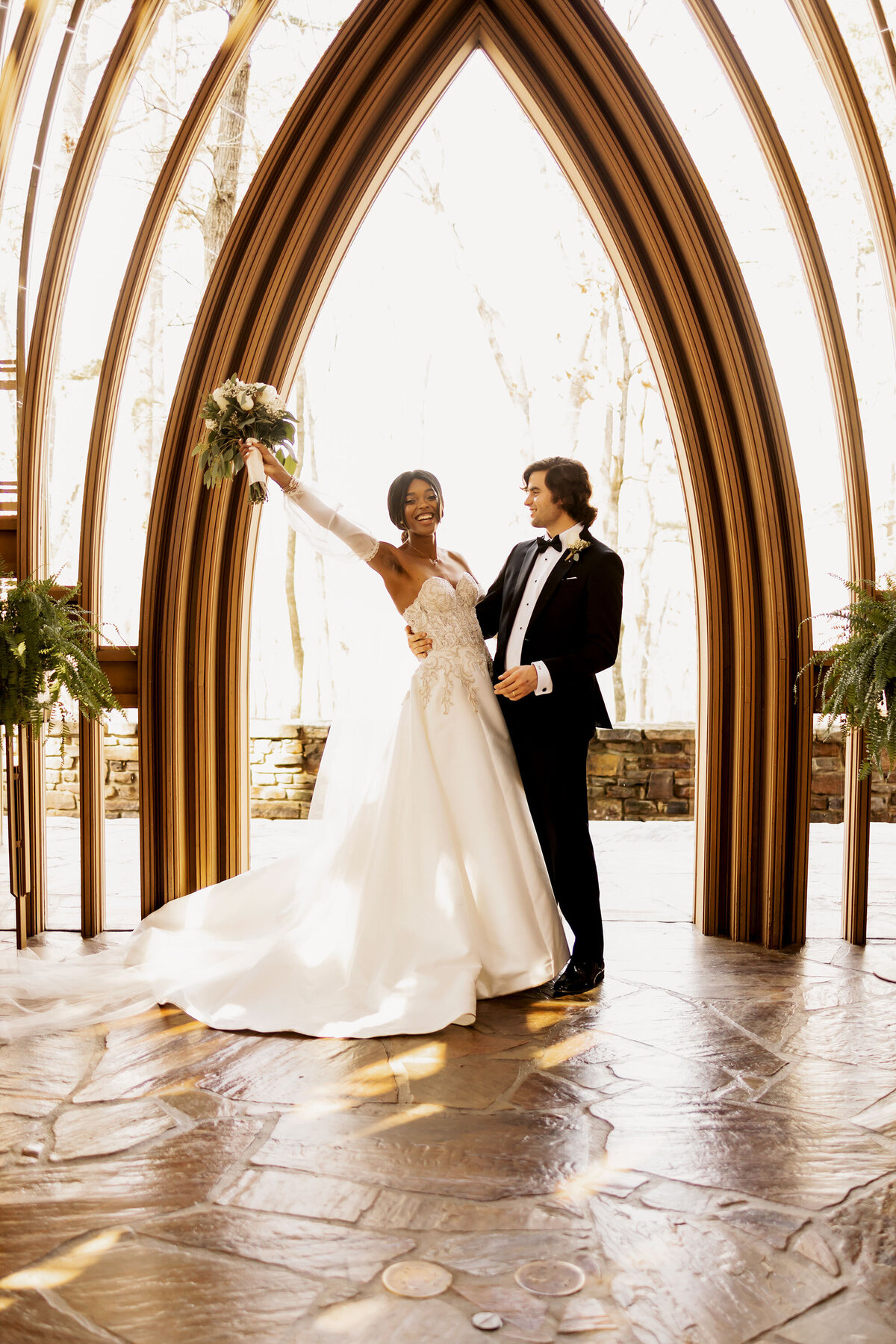 bride and groom  show off the bouquet