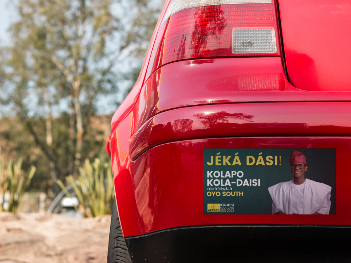 square-sticker-mockup-in-the-back-bumper-of-a-red-car-a15343