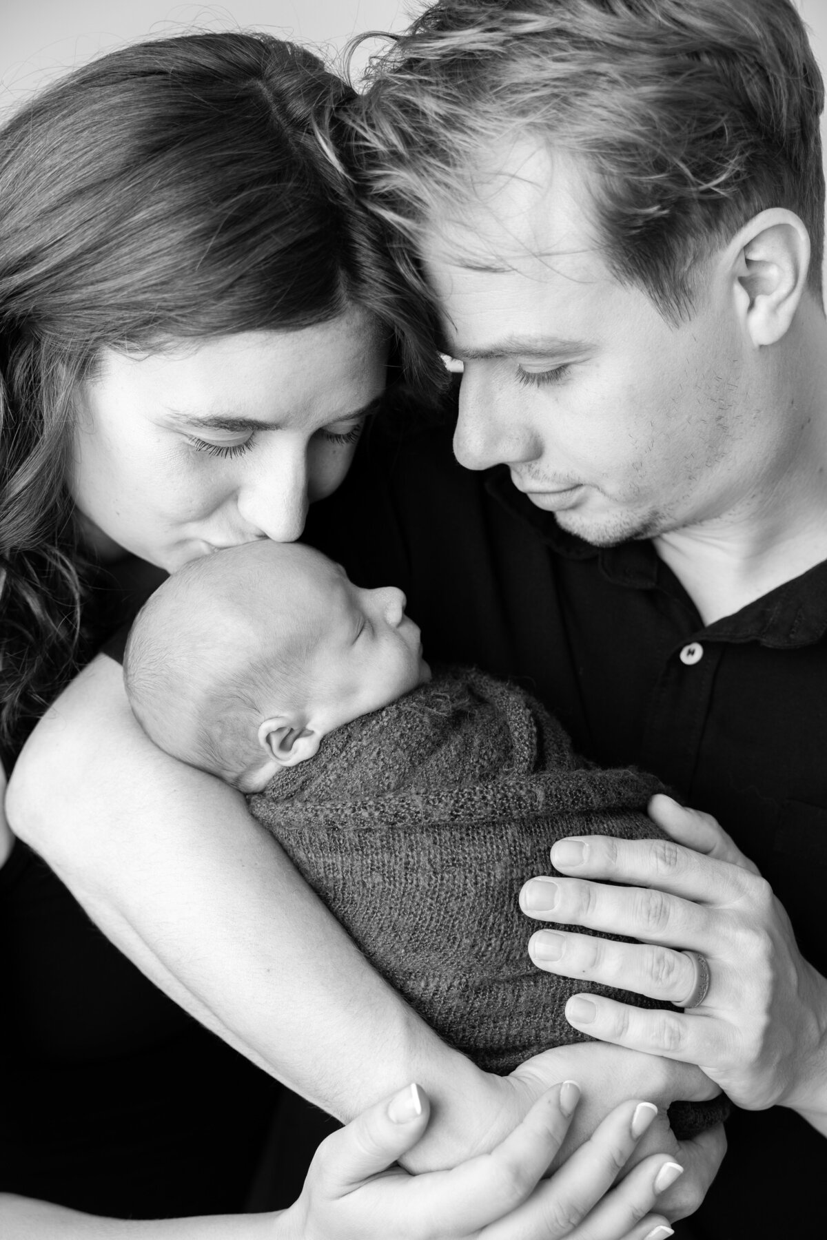 Black and white Edmonton studio parent and newborn pose
