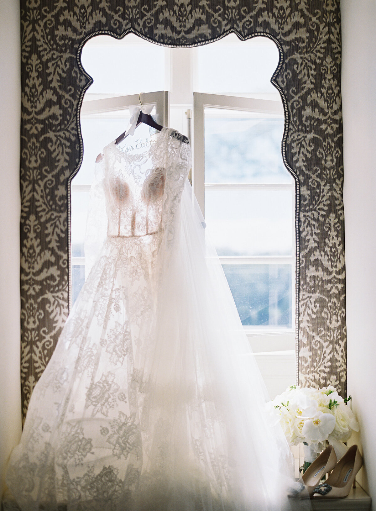 Close up of the dress of the bride on a hanger. 