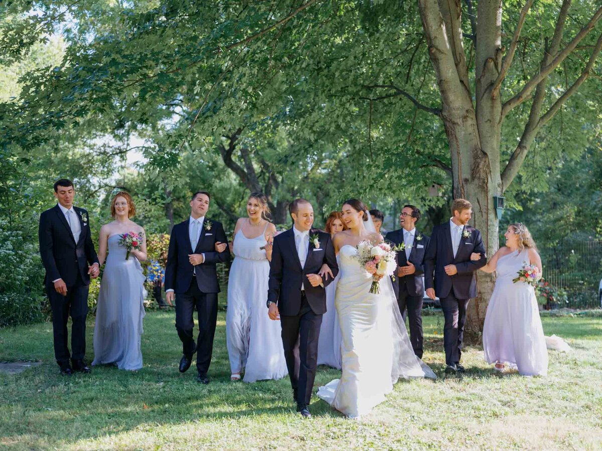 Bridal party with bride and groom at a private residence wedding.