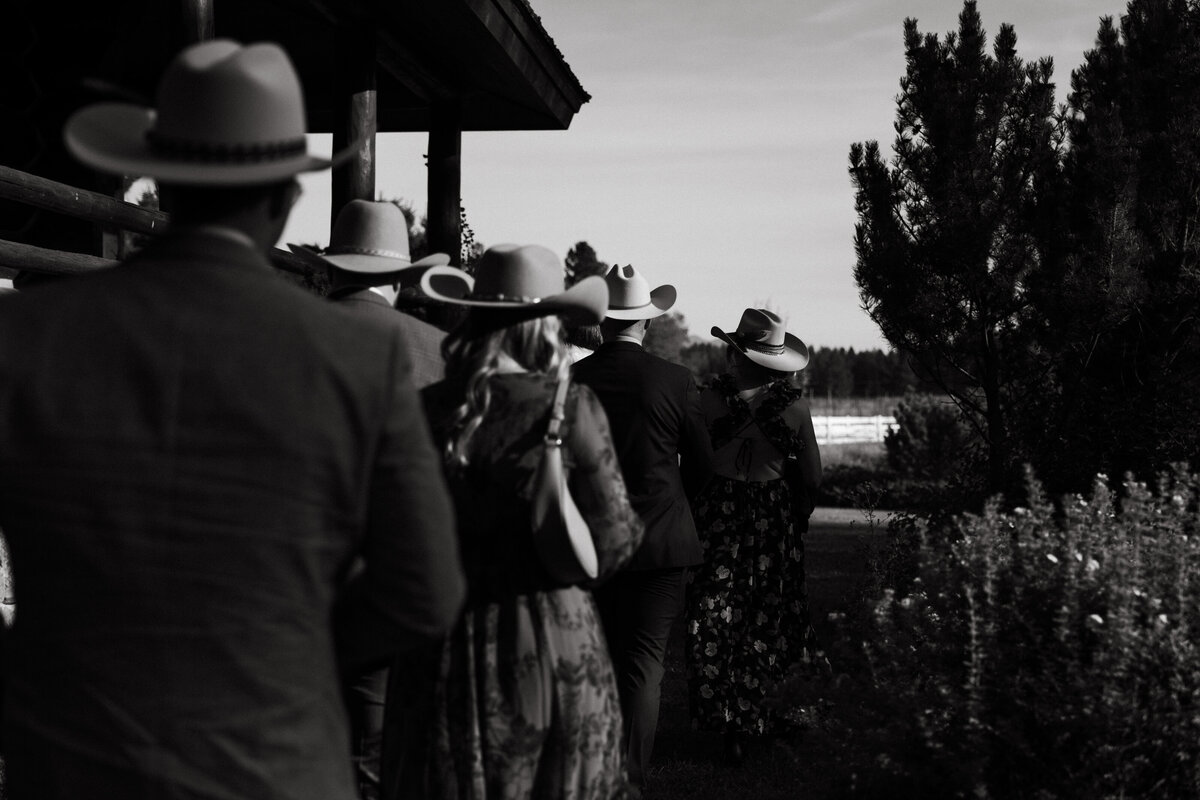 guests in western attire walk towards ceremony entrance