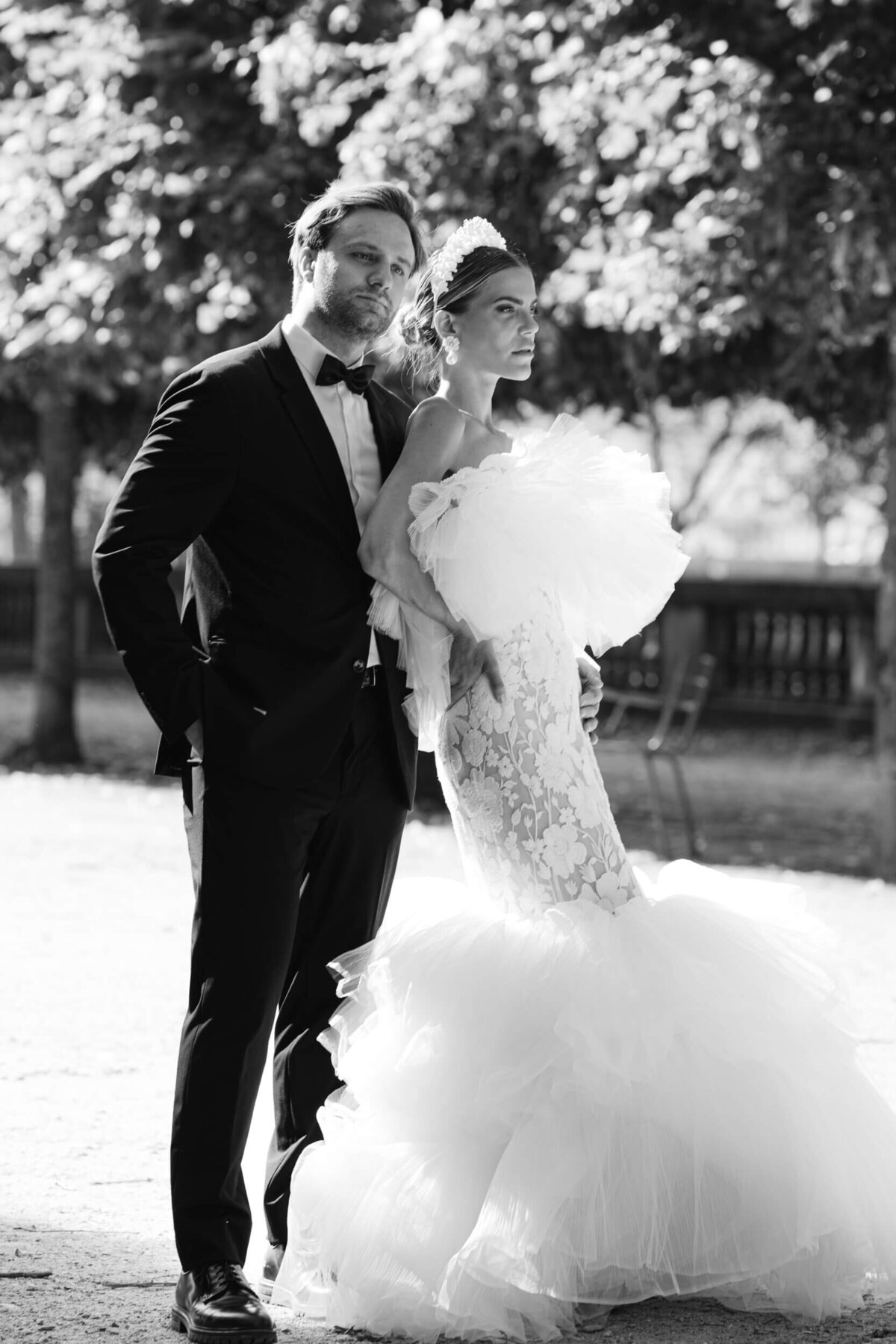 A wedding photo of a bride in her white dress in the streets of Paris in France.