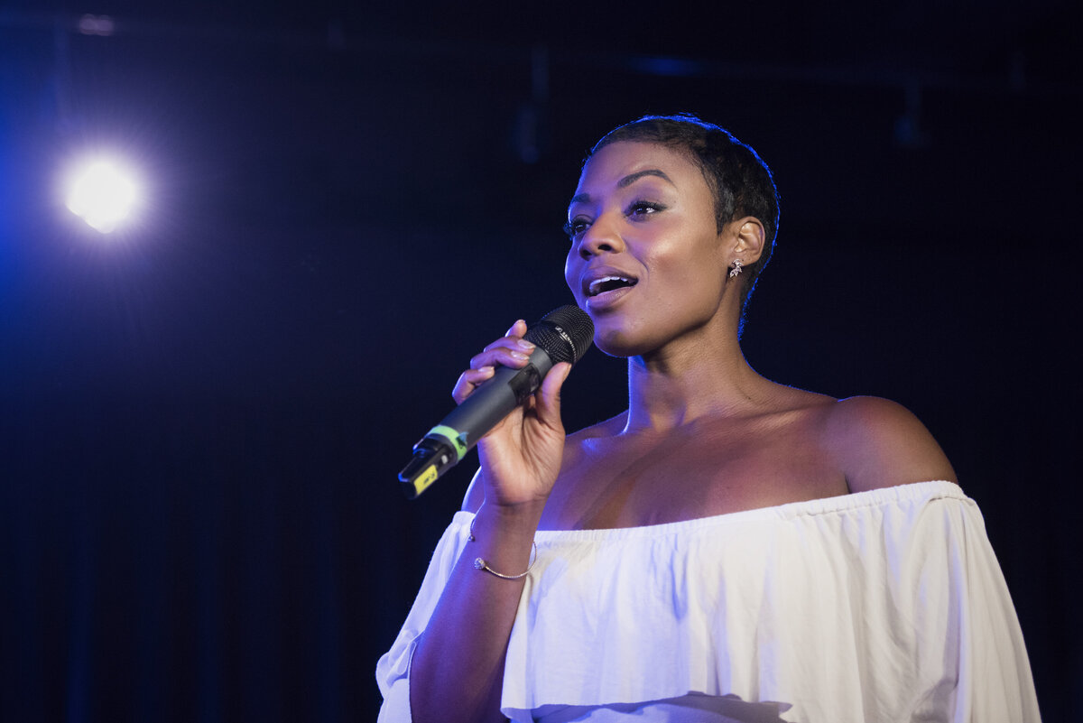 A woman on stage singing