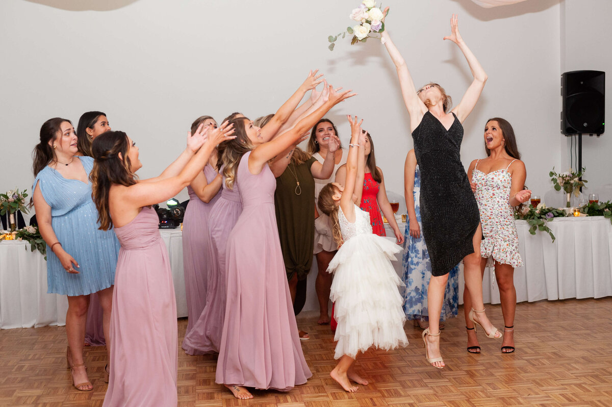 Bouquet toss at Stones River Country Club wedding reception