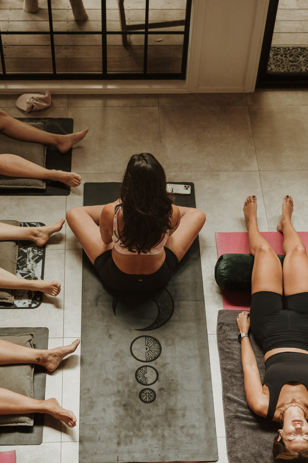 lady sitting on a yoga mat