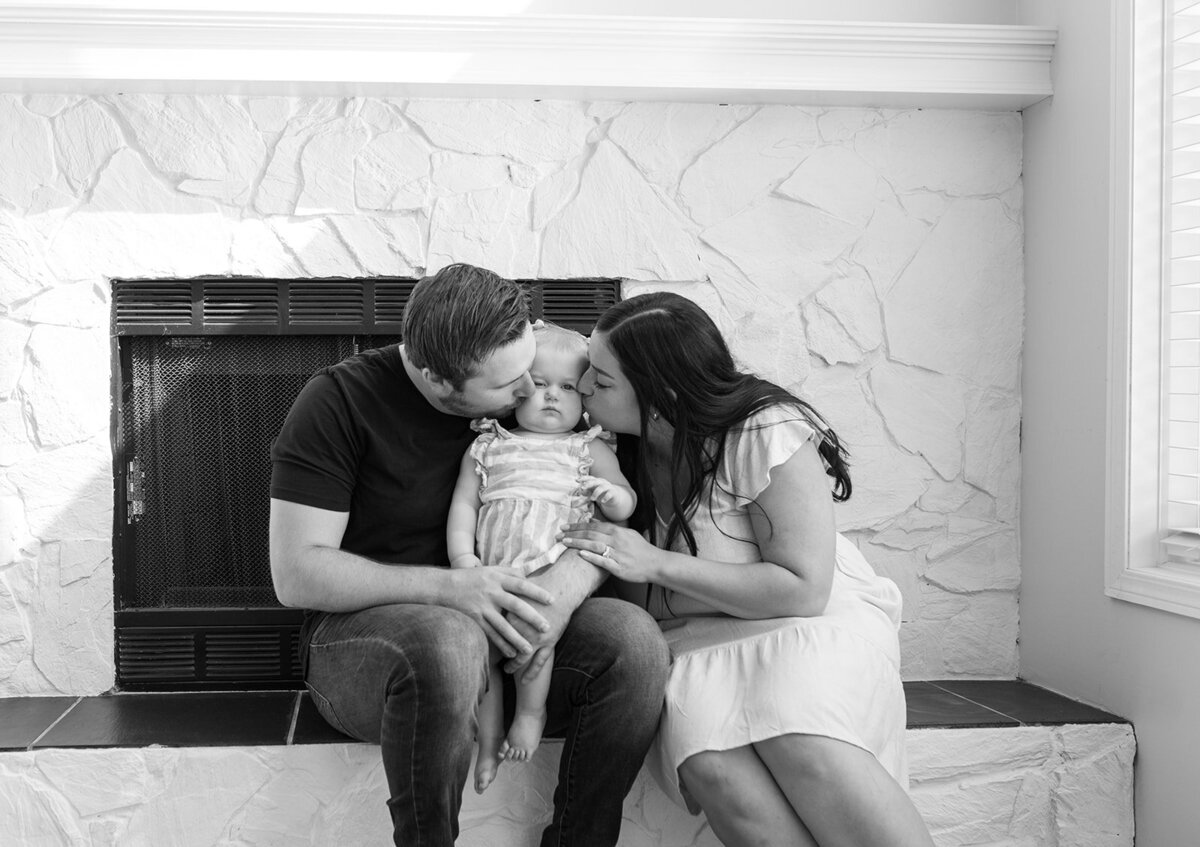 Mom-and-dad-kissing-baby-on-each-cheek