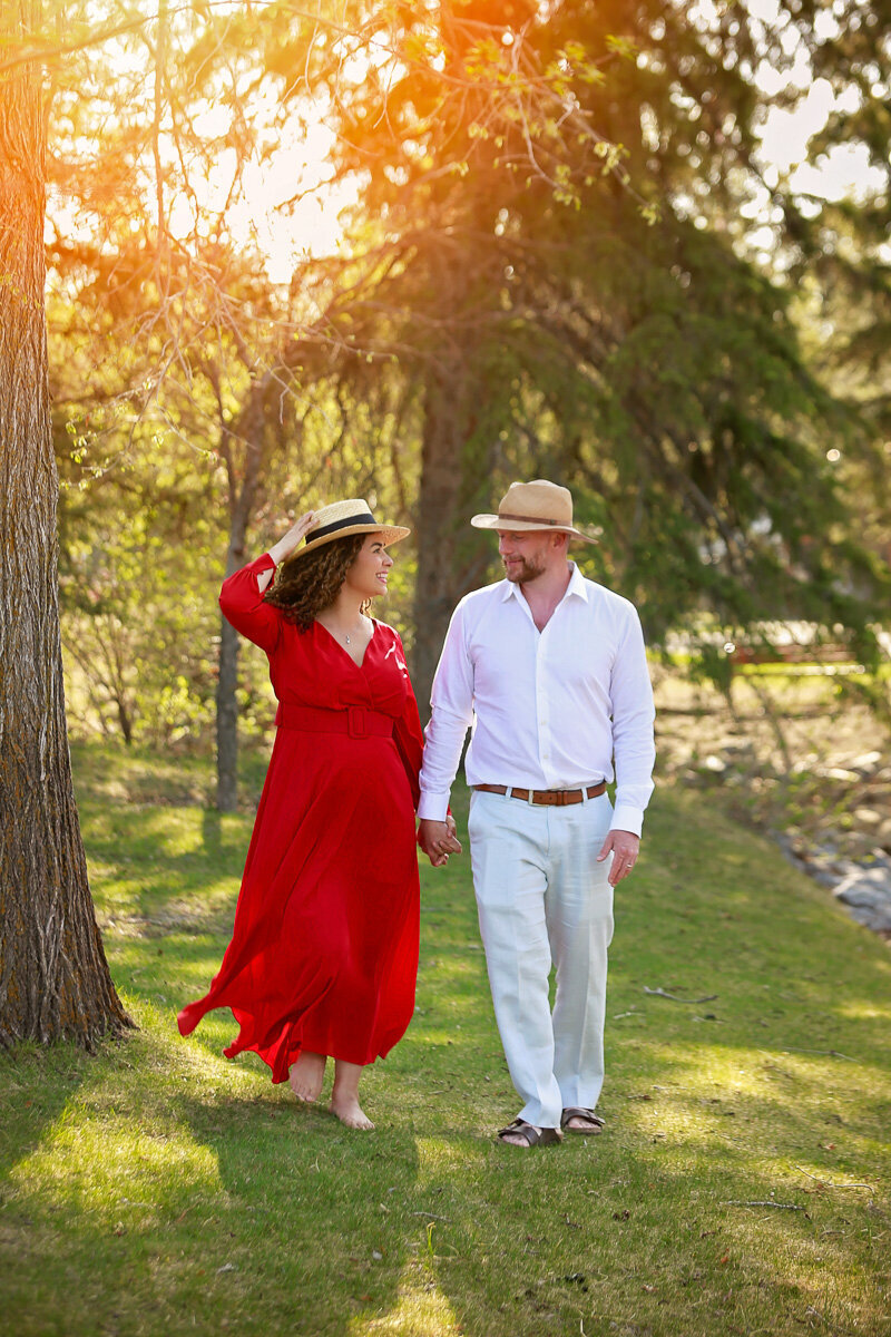 Romantic pregnancy photo shoot in Bowness Park by Yuliia Terziian Photography.