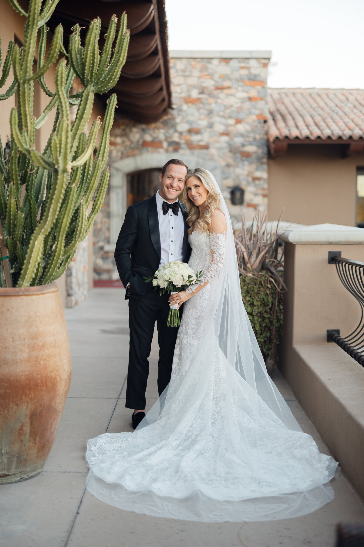 Bride and groom posing for newlywed portrait at Paradise Valley Country Club