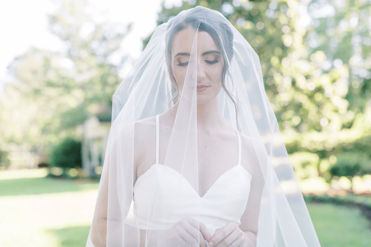 The veil covers the bride completely.