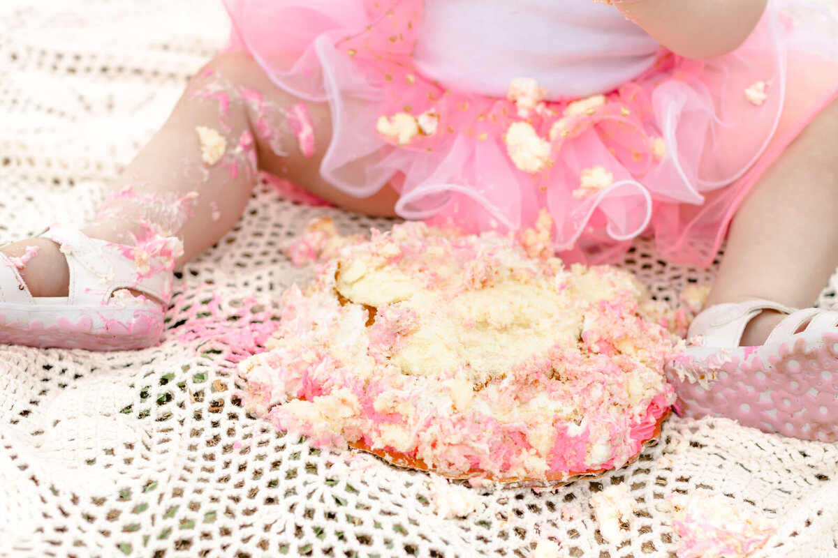 Close up of a smashed cake during one-year-old's milestone session in Flowery Branch