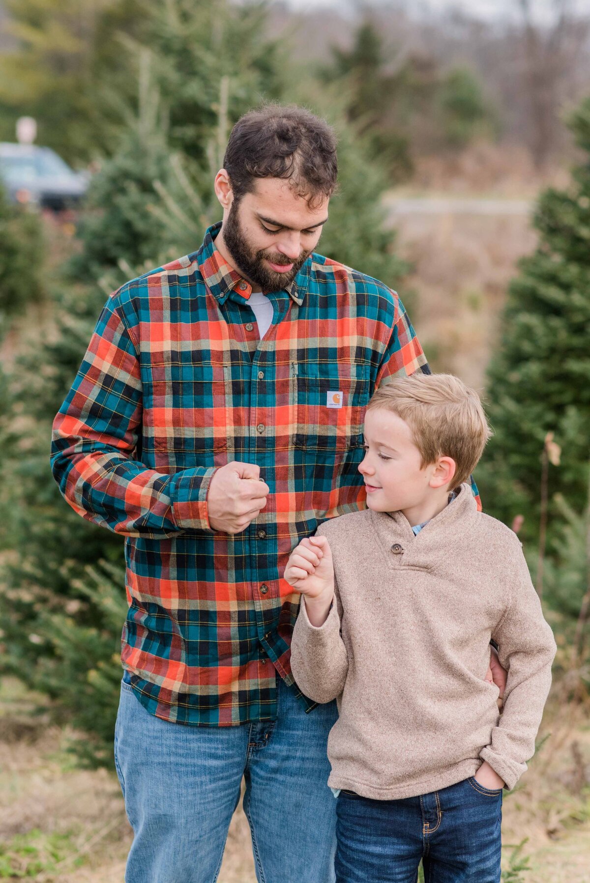 Step son and step dad at christmas tree farm