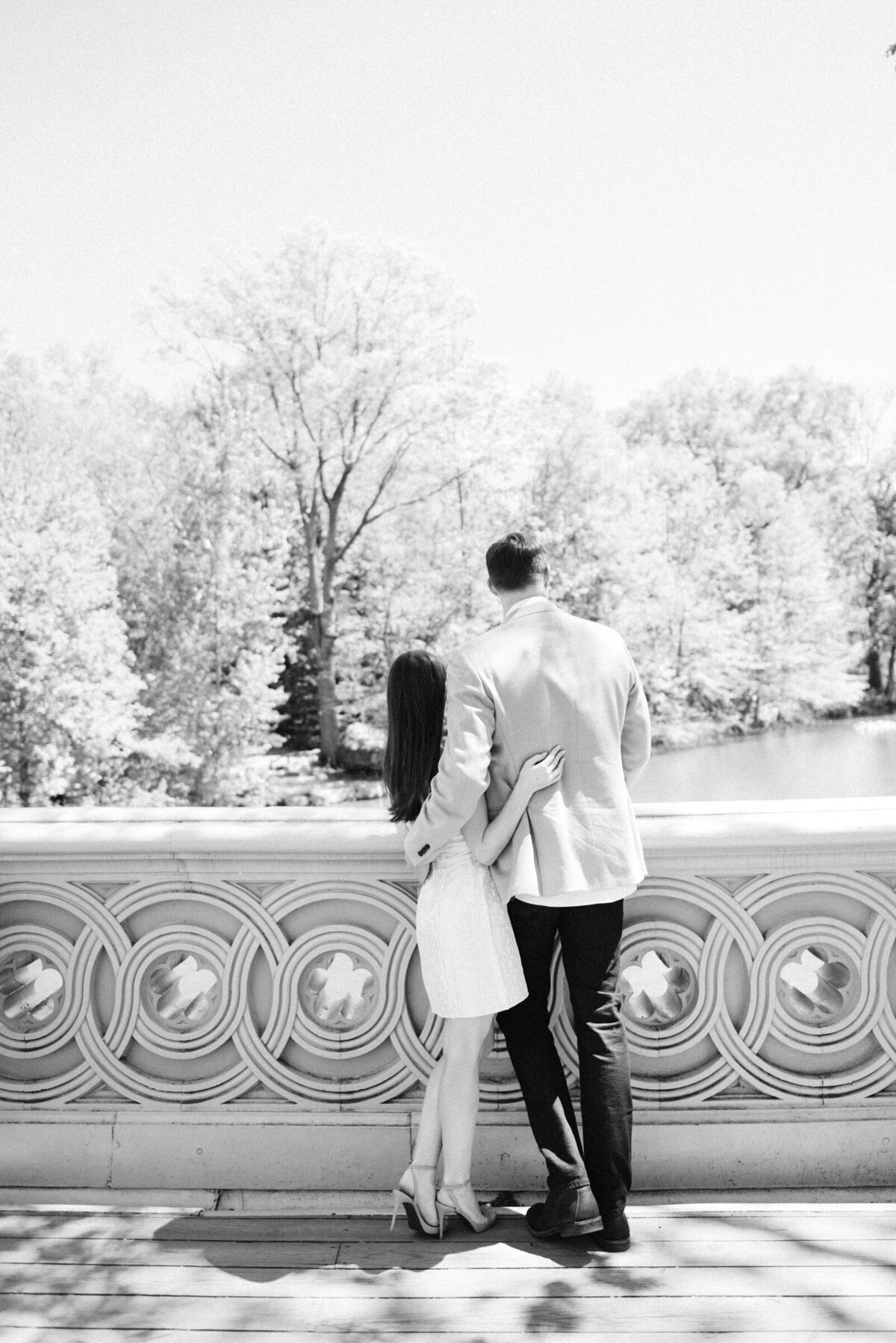 wedding photographer in NYC engagement photos at the Bow Bridge
