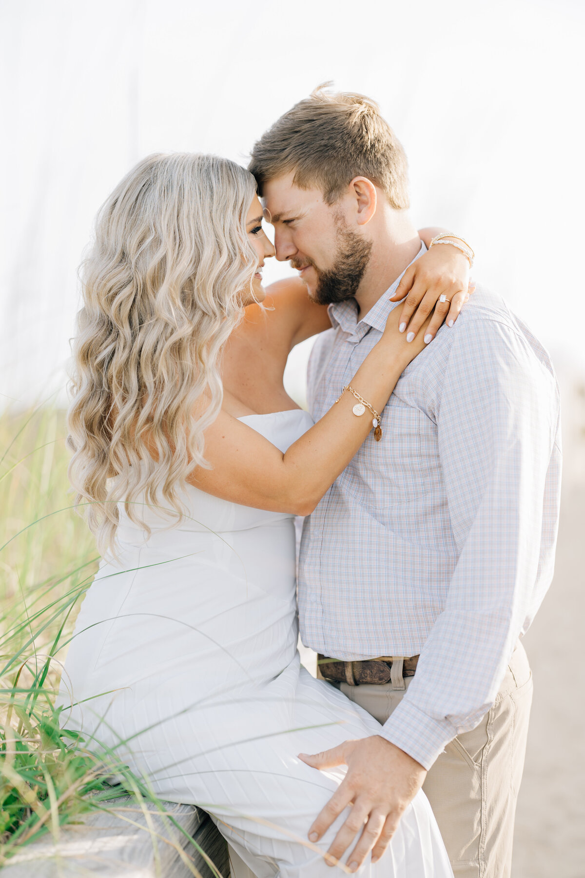engaged couple embracing romantically