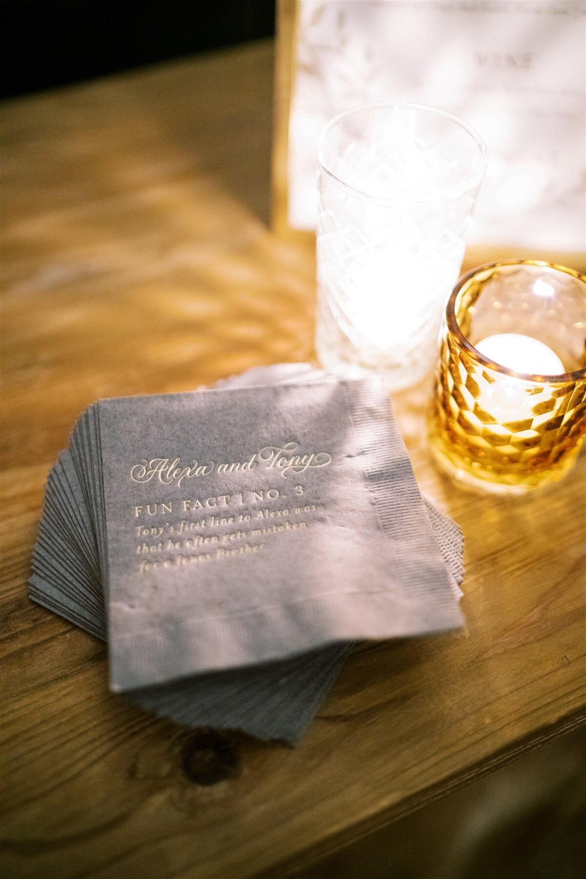 Close up of the napkins that share fun facts about the bride and groom. 
