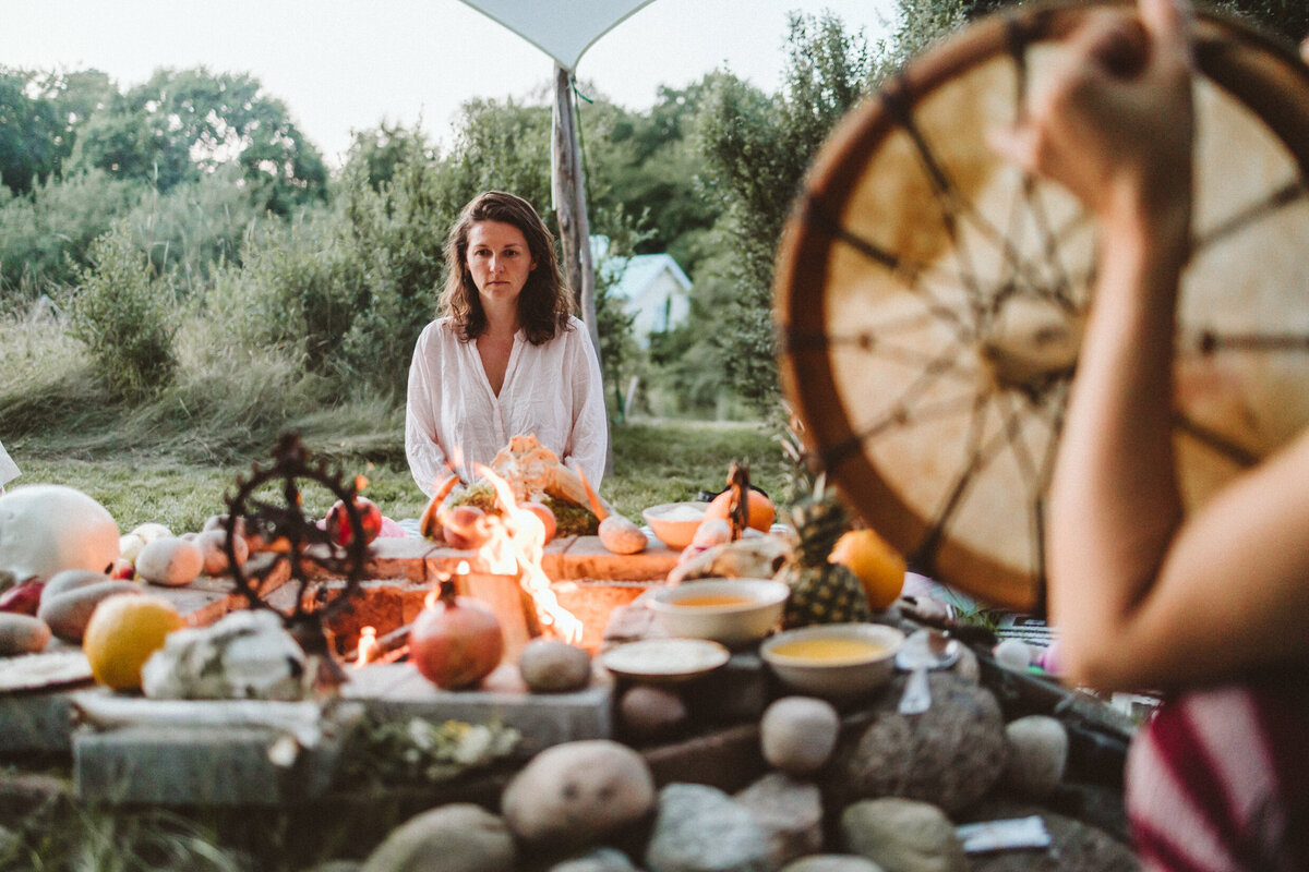 woman in front of fire outdoors