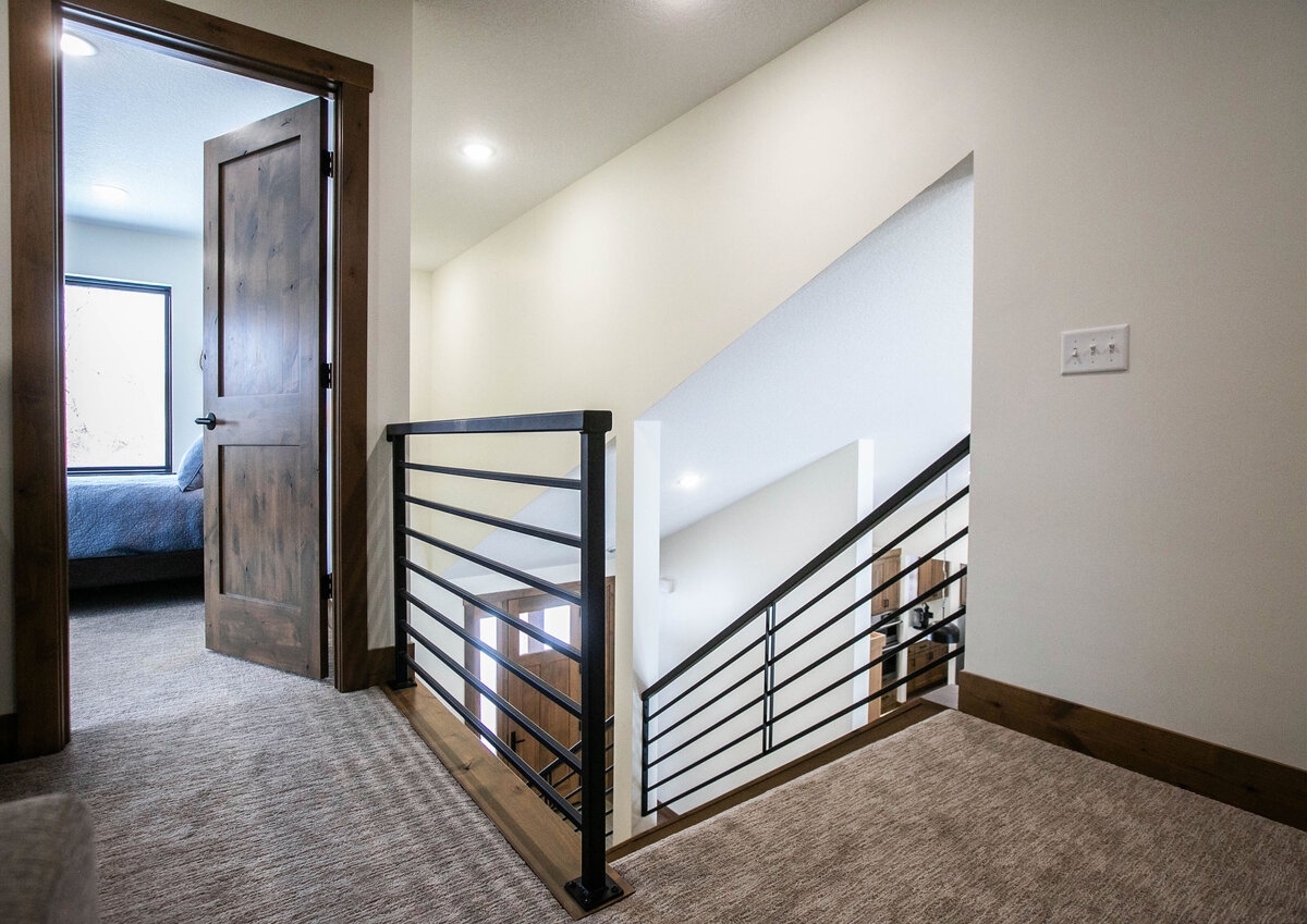 Open Concept loft with neutral tones and modern accents in custom Elk RIver home