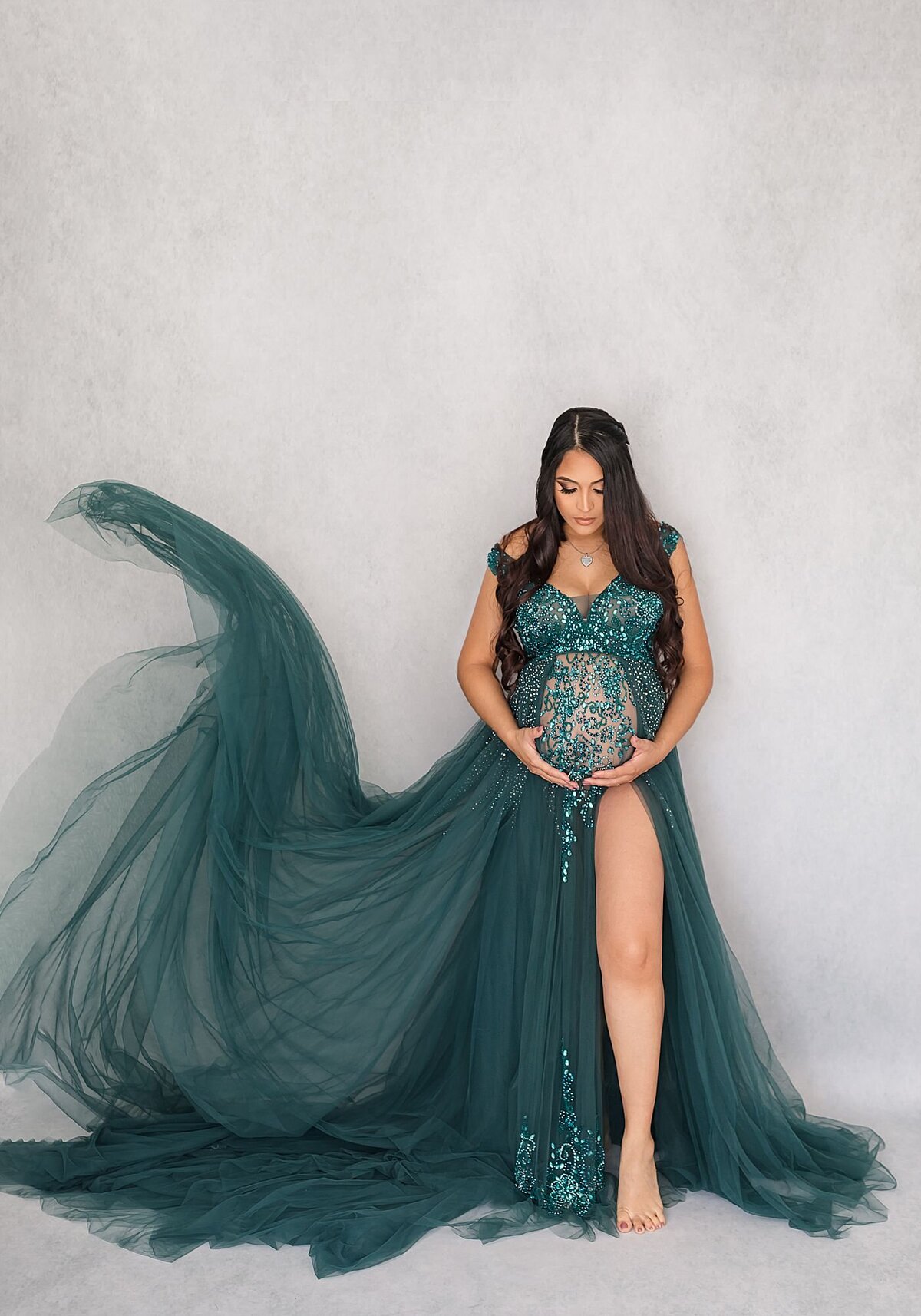 green maternity dress during orlando maternity photo session