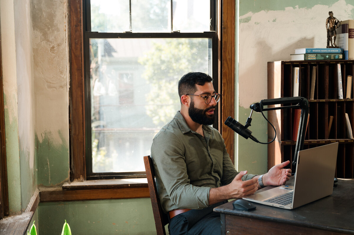 Creative brand photography for a holistic medicine podcast by Nico Misleh surrounded by vintage medical vibe