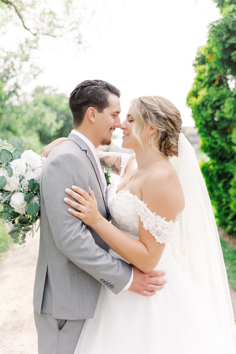 couple leaning toward each other by minneapolis wedding photographer