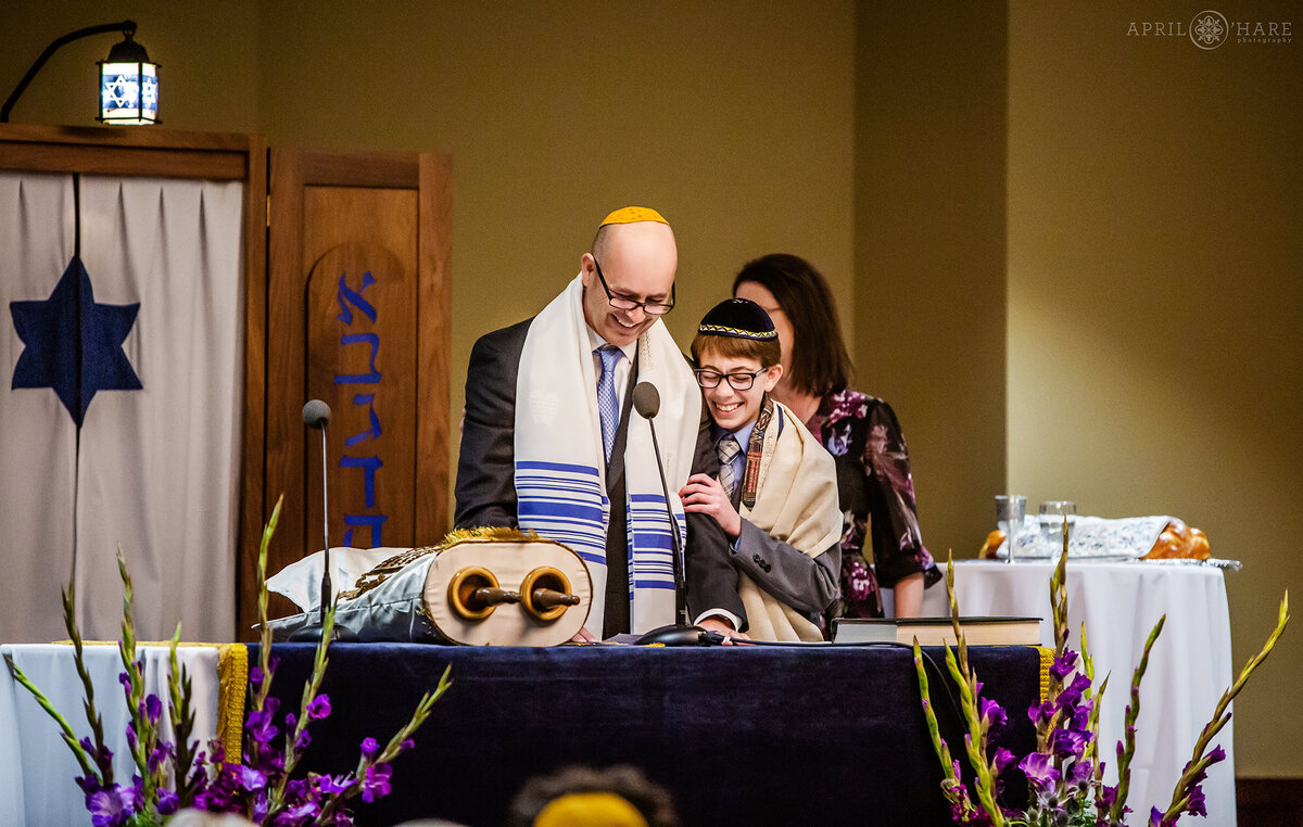 Father and Son Laugh During Bar Mitzvah Service in Fort Collins Colorado